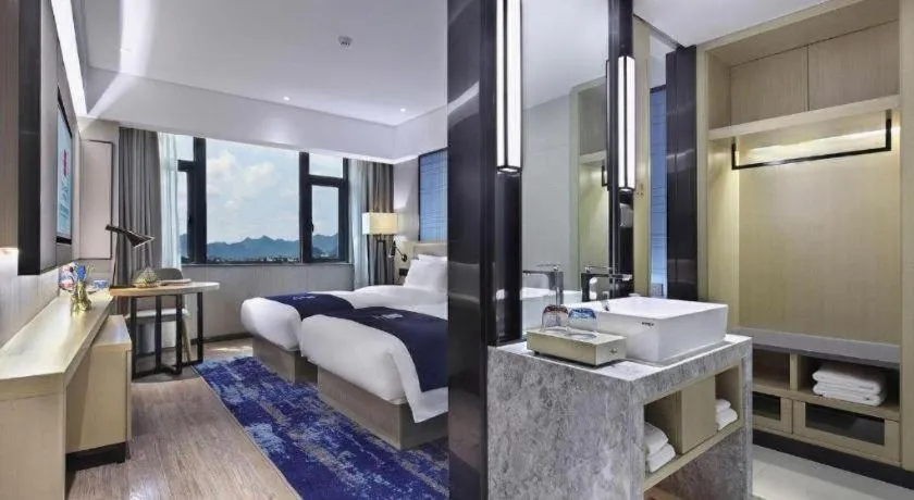 Bed in Echarm Hotel Guilin North High Speed Railway Station