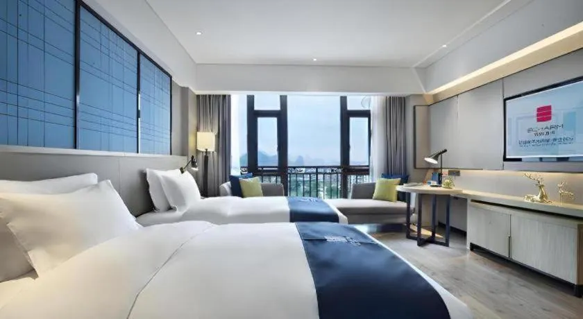 Bed in Echarm Hotel Guilin North High Speed Railway Station