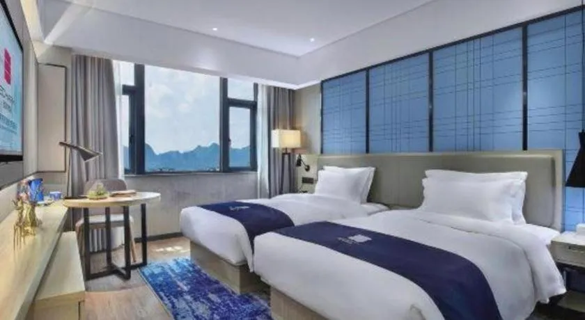 Bed in Echarm Hotel Guilin North High Speed Railway Station