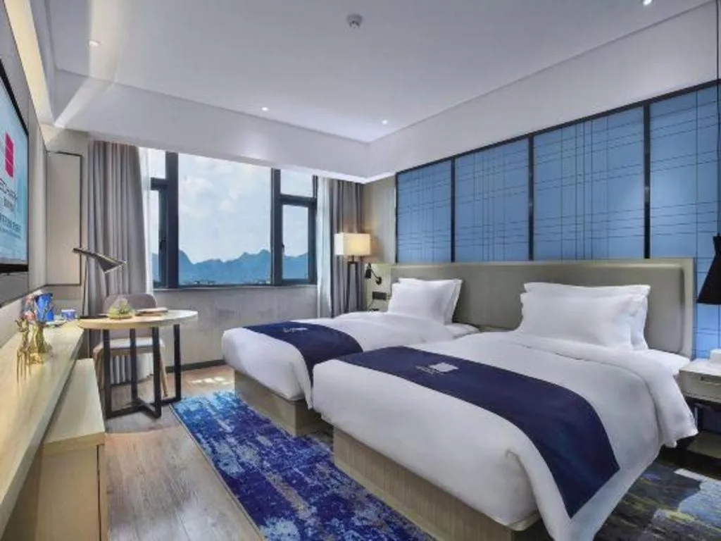 Bed in Echarm Hotel Guilin North High Speed Railway Station