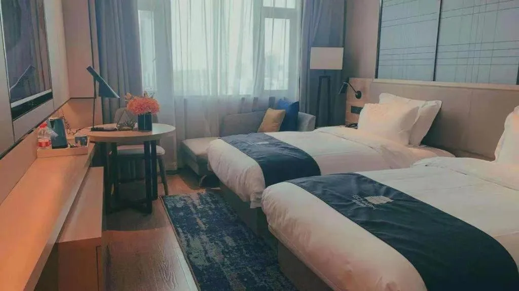 Bed in Echarm Hotel Guilin North High Speed Railway Station