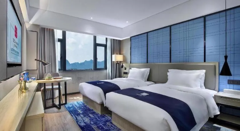 Bed in Echarm Hotel Guilin North High Speed Railway Station