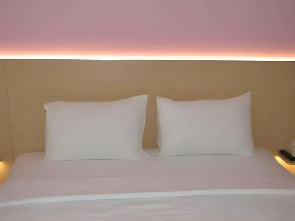 Bed in I&M Hotel Billiard