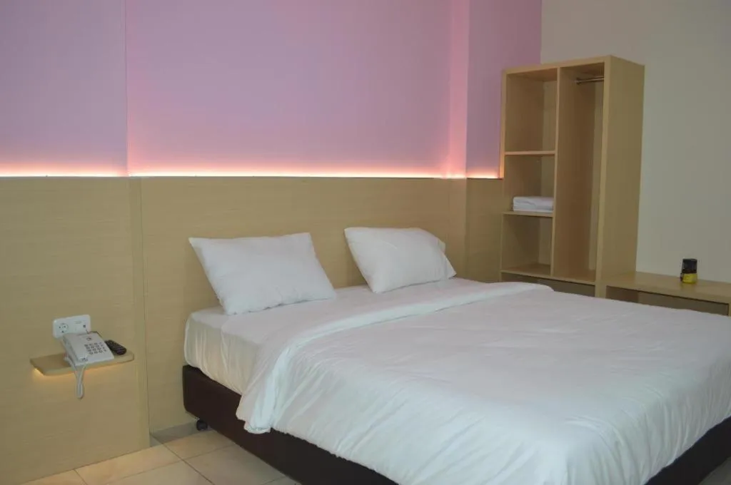 Bed in I&M Hotel Billiard