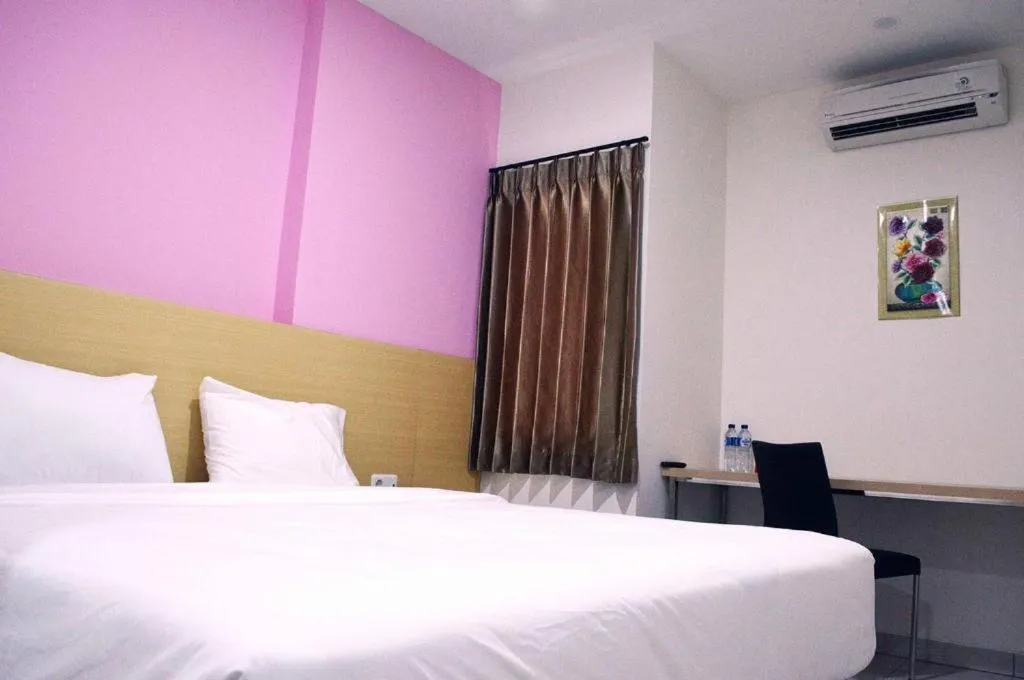 Bed in I&M Hotel Billiard