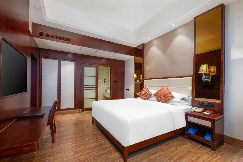 Bed in Haikou Kai Wei Hotel