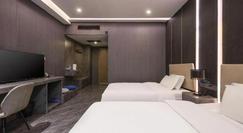 Bed in Haikou Kai Wei Hotel