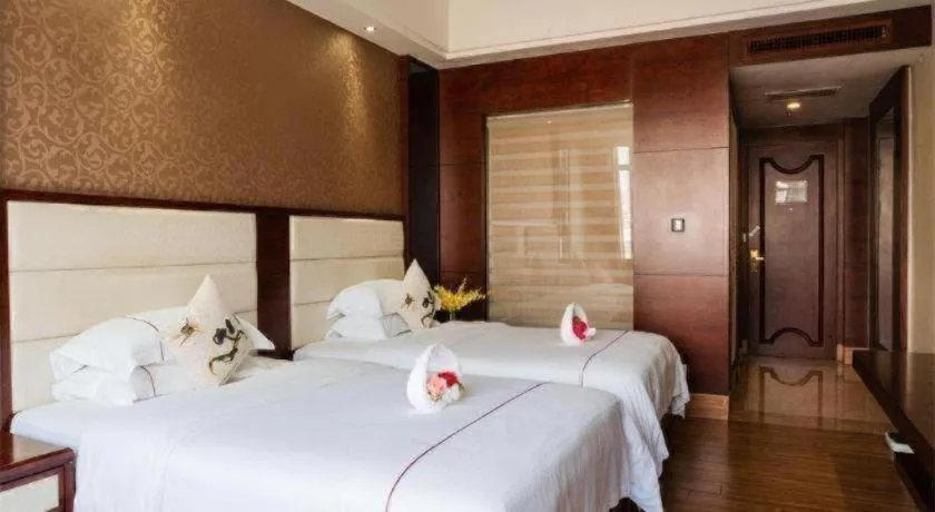 Bed in Haikou Kai Wei Hotel