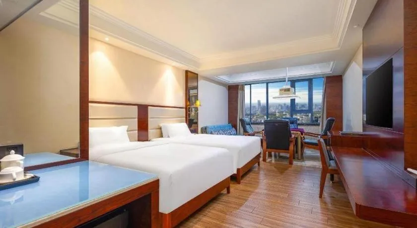 Bed in Haikou Kai Wei Hotel