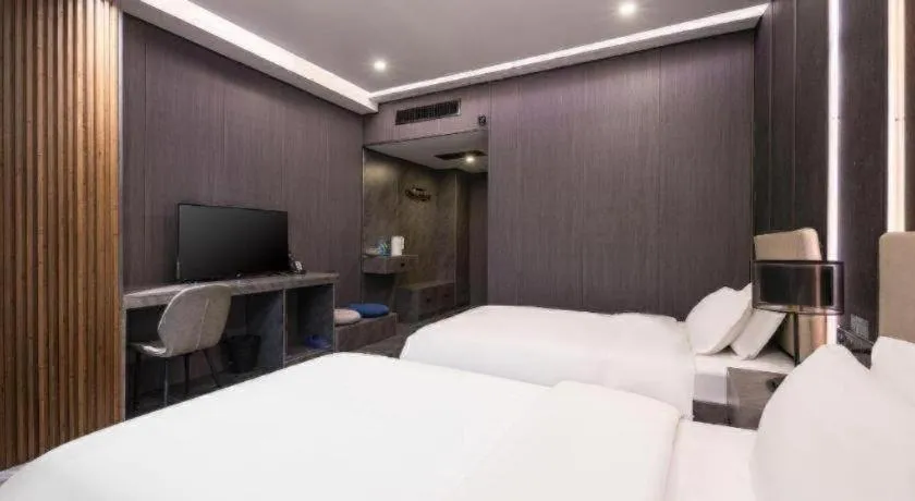 Bed in Haikou Kai Wei Hotel