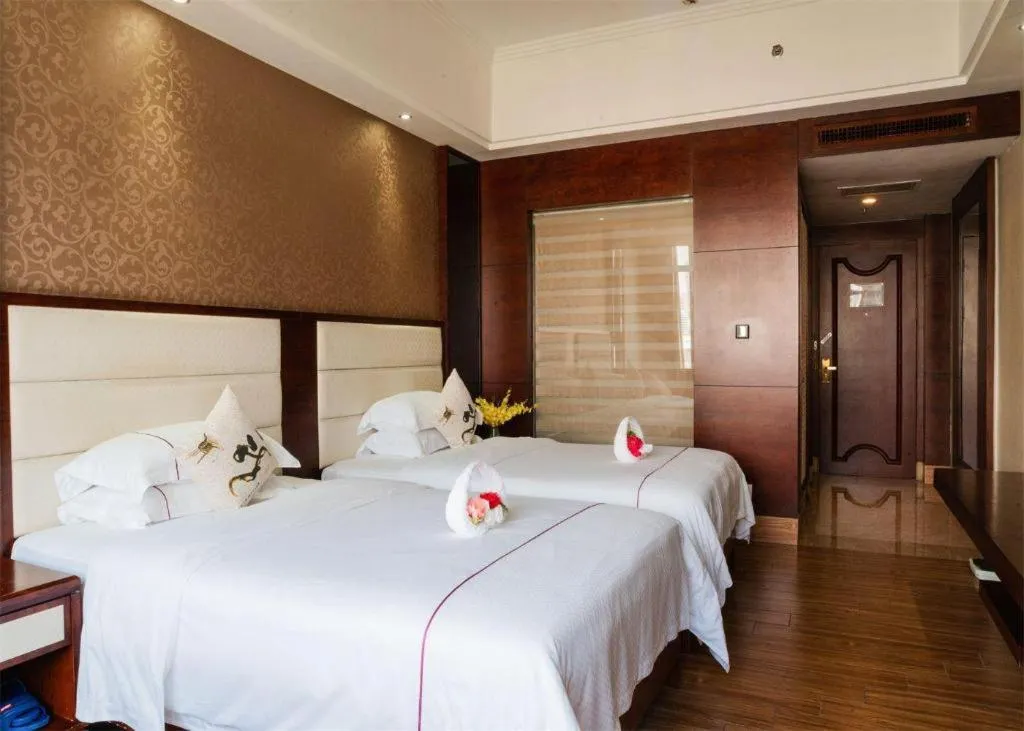 Bed in Haikou Kai Wei Hotel