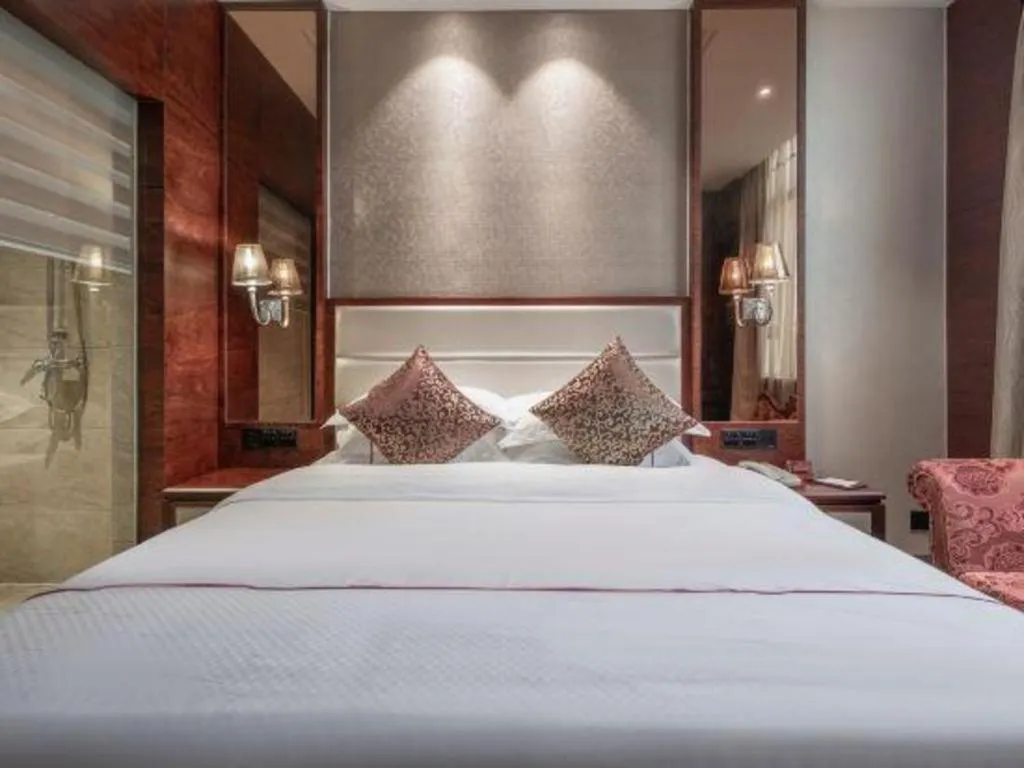 Bed in Haikou Kai Wei Hotel
