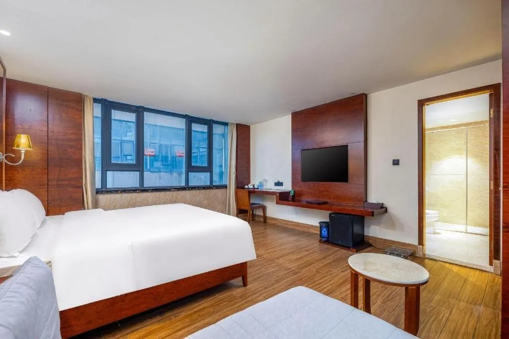 Bed in Haikou Kai Wei Hotel