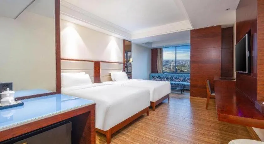 Bed in Haikou Kai Wei Hotel