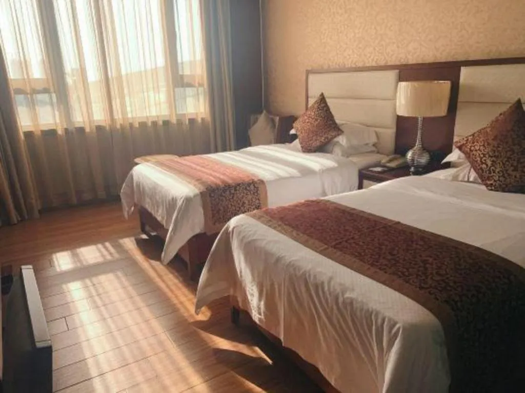 Bed in Haikou Kai Wei Hotel