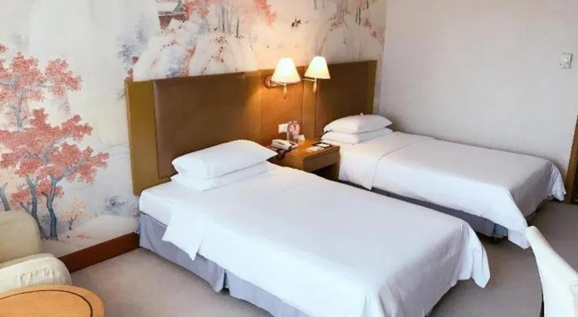 Bed in Culture Plaza Hotel