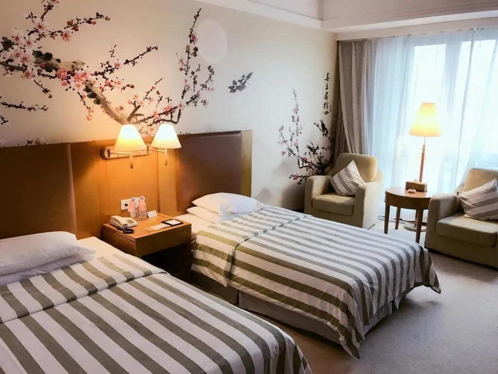 Bed in Culture Plaza Hotel