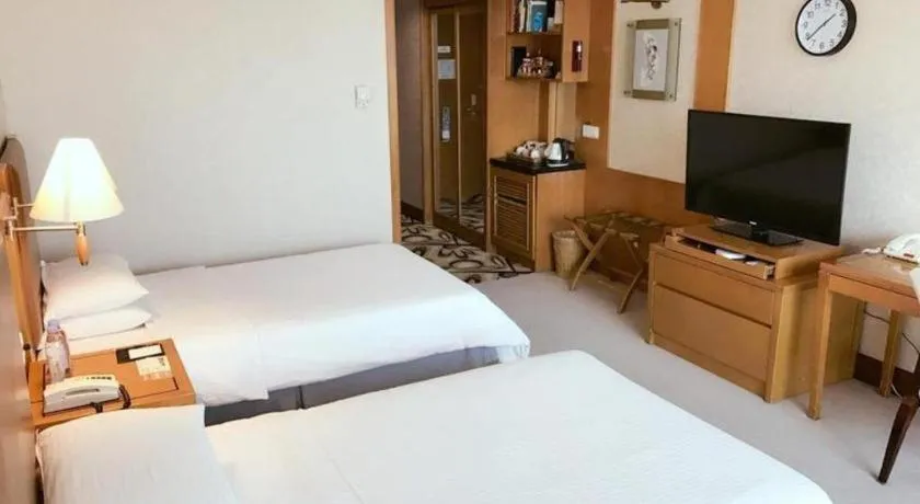 Bed in Culture Plaza Hotel