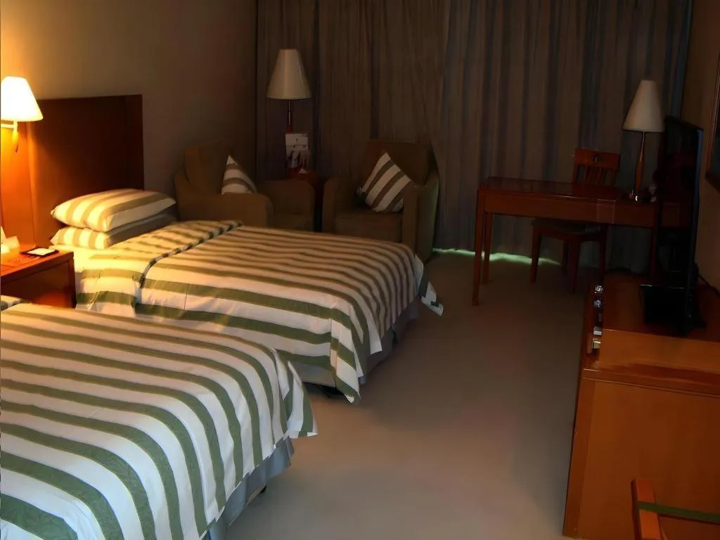 Bed in Culture Plaza Hotel