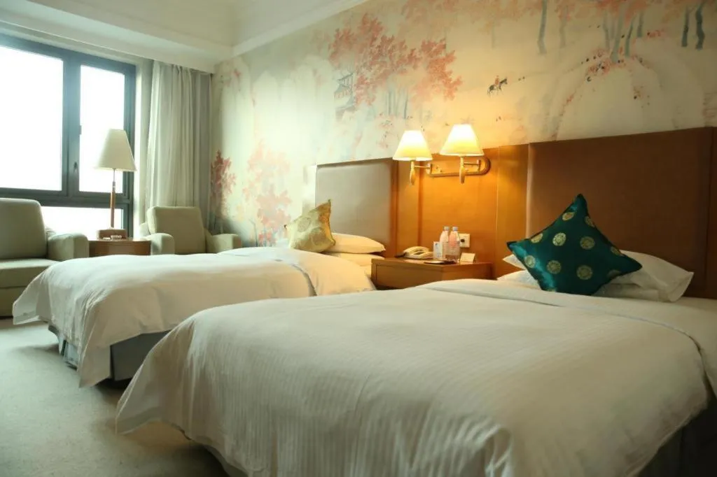 Bed in Culture Plaza Hotel