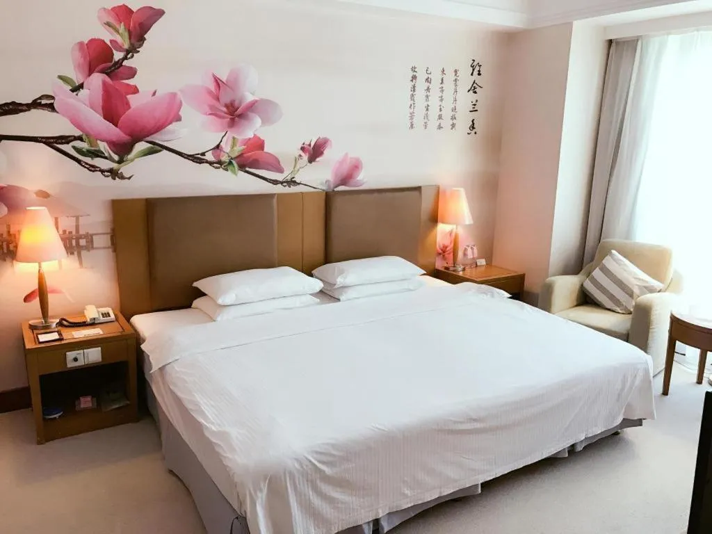 Bed in Culture Plaza Hotel