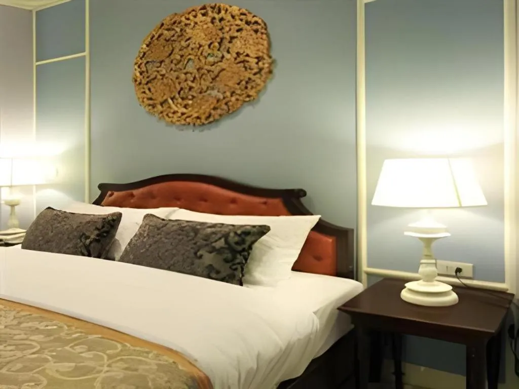 Bed in Khamthana the Colonial Hotel Chiangrai