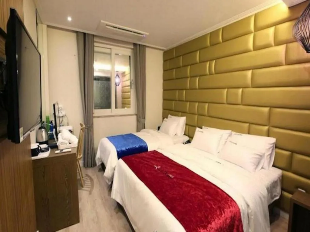 Bed in Jeju Lux Hotel