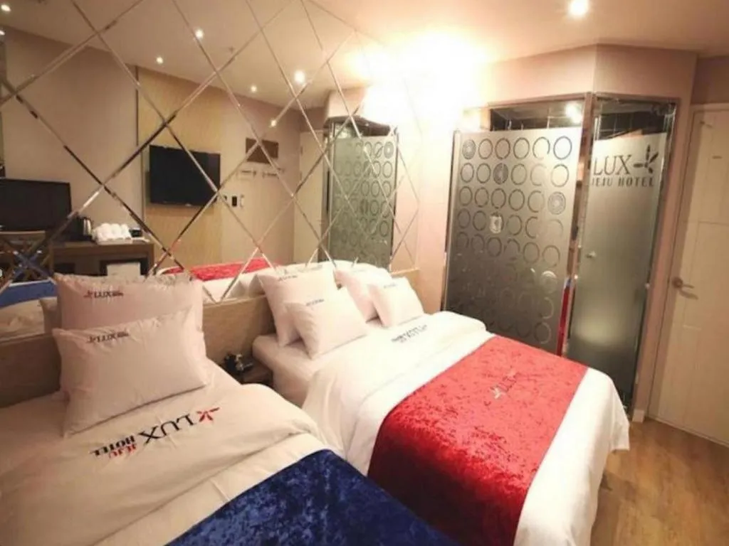 Bed in Jeju Lux Hotel