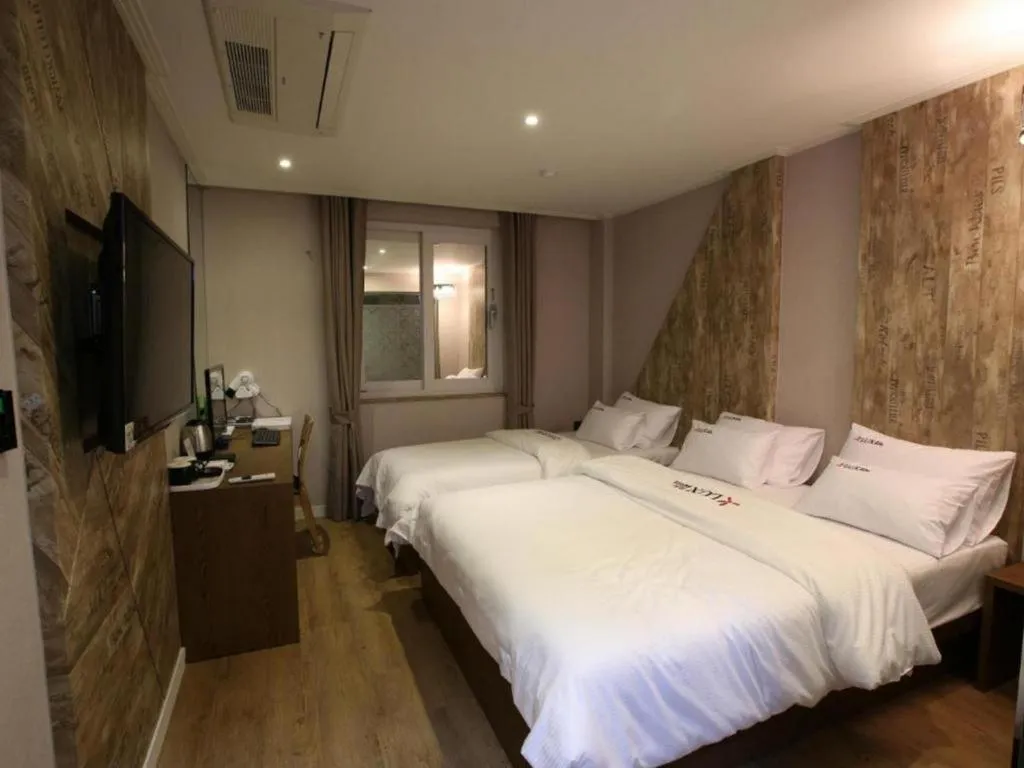 Bed in Jeju Lux Hotel