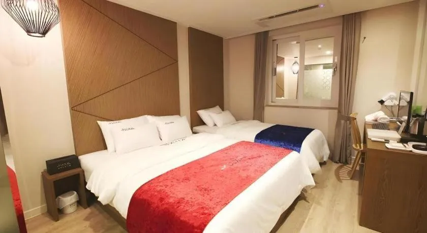 Bed in Jeju Lux Hotel