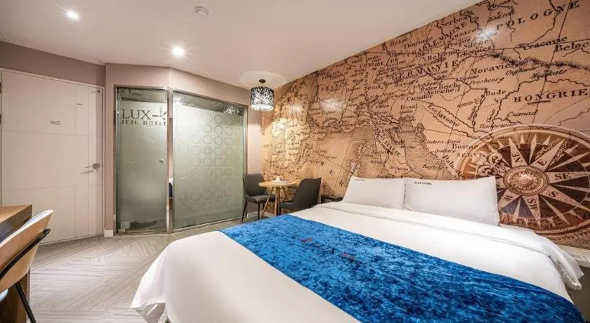 Bed in Jeju Lux Hotel