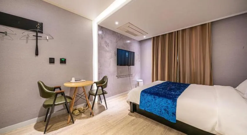 Bed in Jeju Lux Hotel