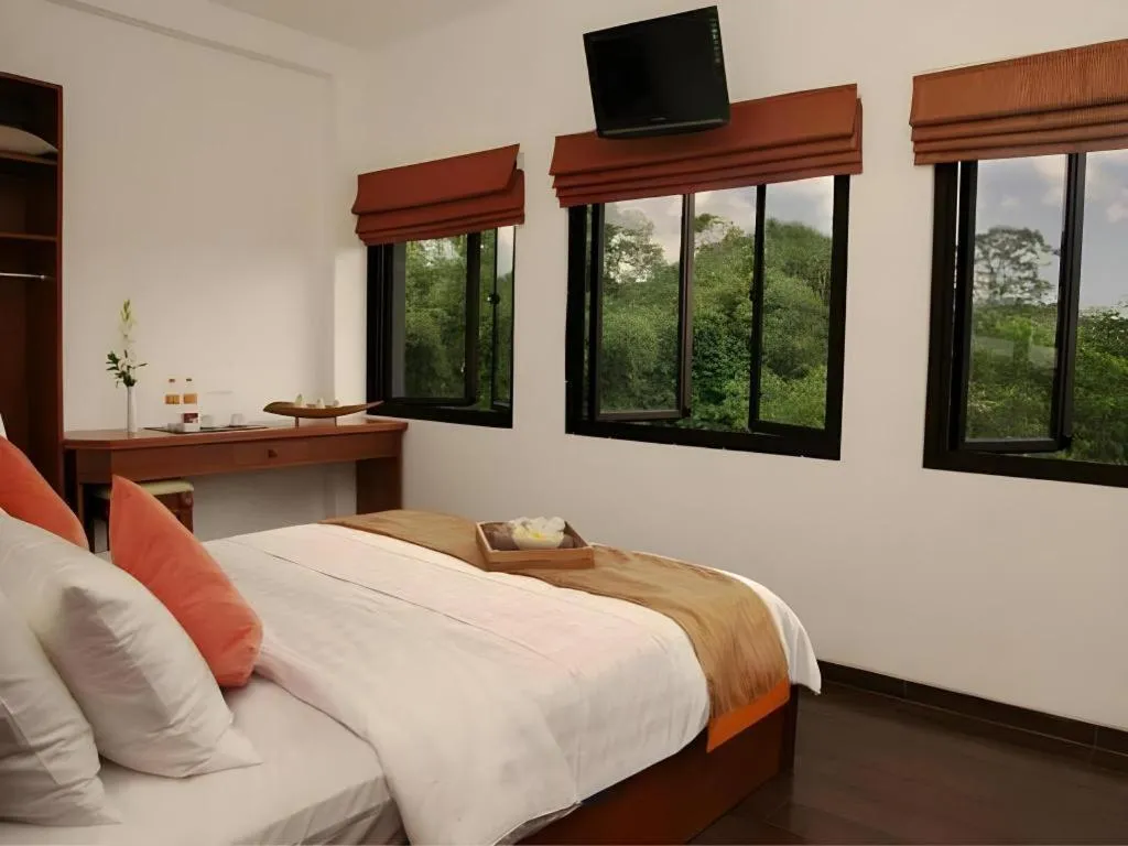 Bed in Hotel Amira Pasteur