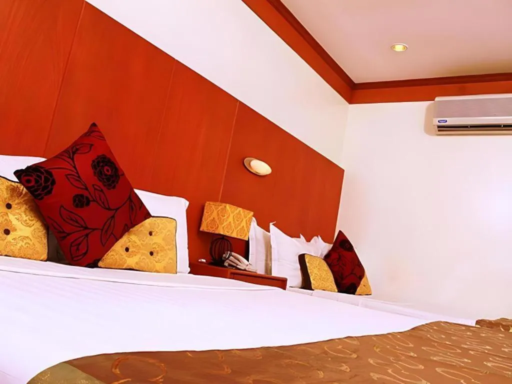 Bed in Naga Land Hotel