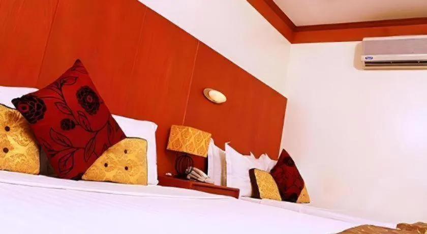 Bed in Naga Land Hotel