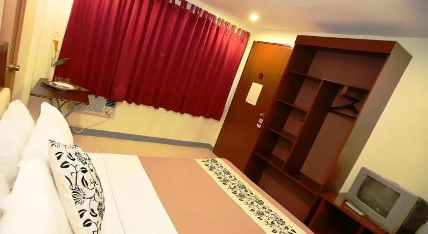 Bed in Naga Land Hotel