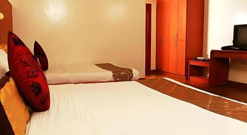 Bed in Naga Land Hotel