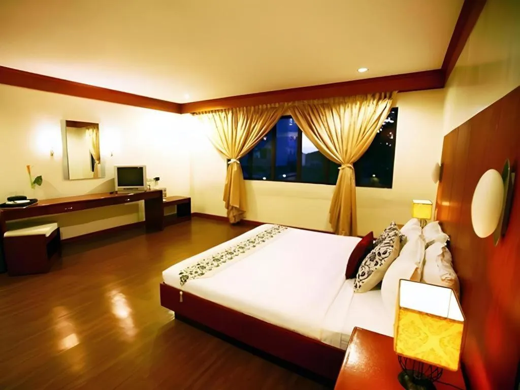 Bed in Naga Land Hotel