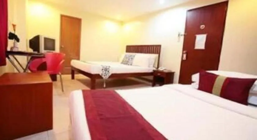 Bed in Naga Land Hotel