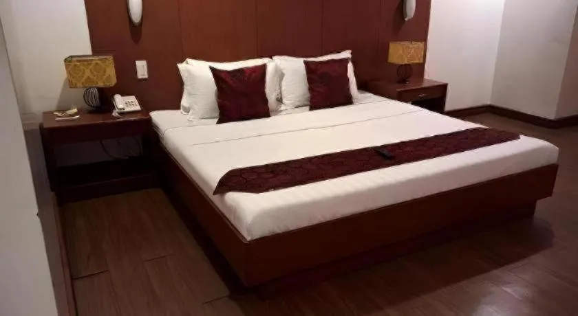 Bed in Naga Land Hotel