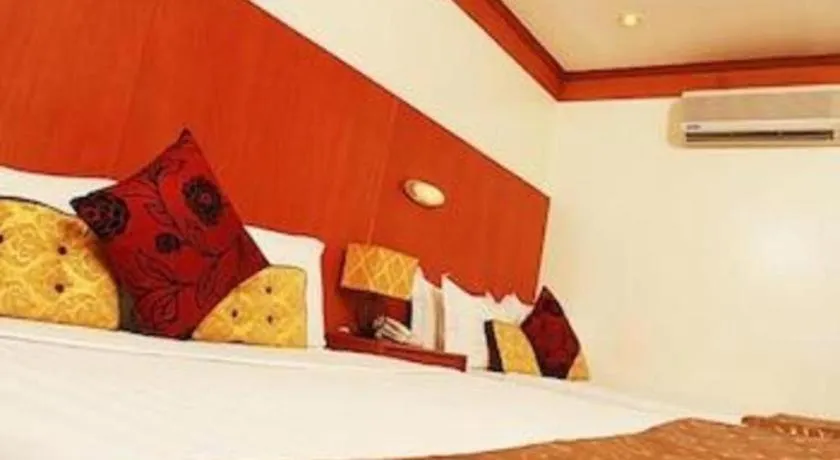 Bed in Naga Land Hotel