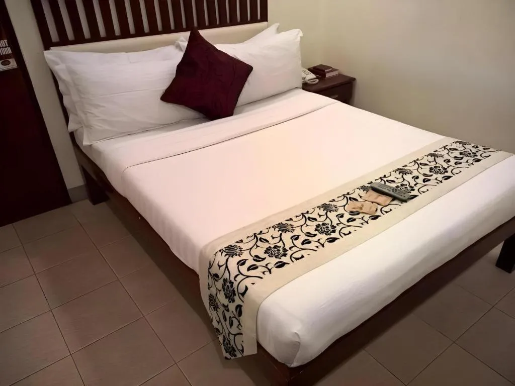 Bed in Naga Land Hotel