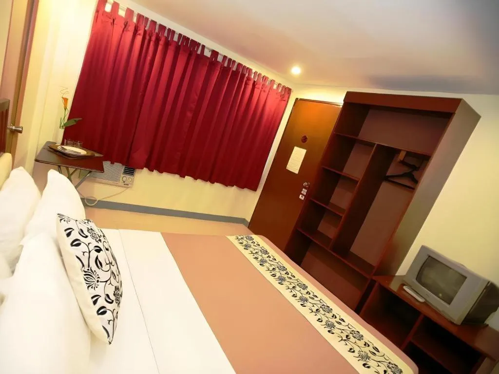 Bed in Naga Land Hotel