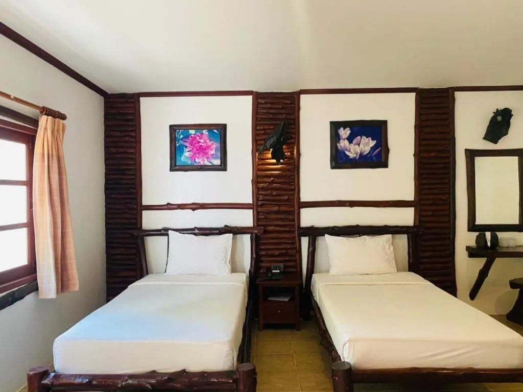 Bed in Alongkot Beach Resort Khanom