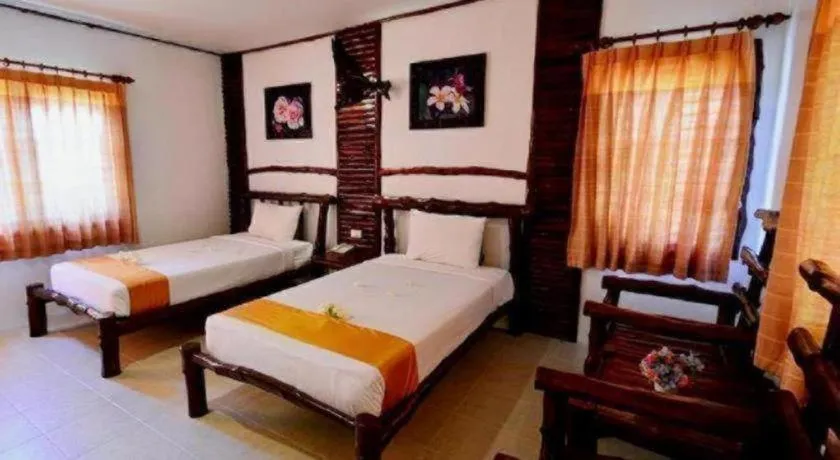 Bed in Alongkot Beach Resort Khanom