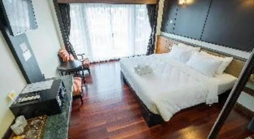 Bed in LANDMARK NAKHONPHANOM HOTEL