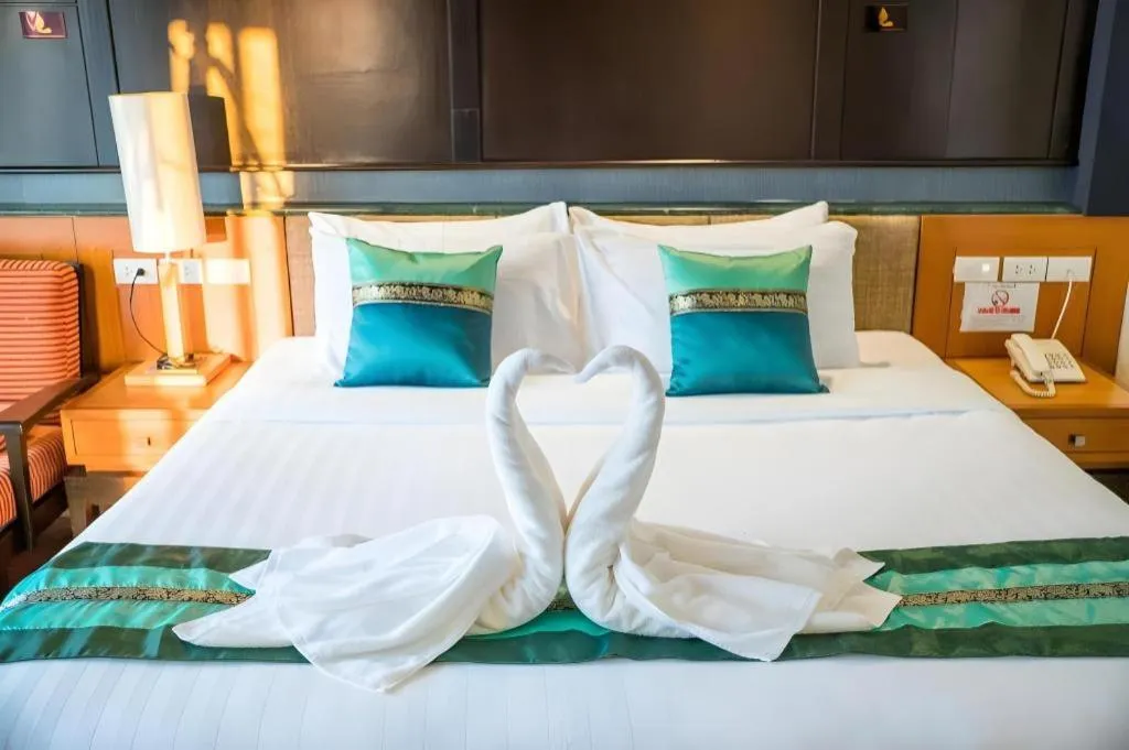 Bed in LANDMARK NAKHONPHANOM HOTEL