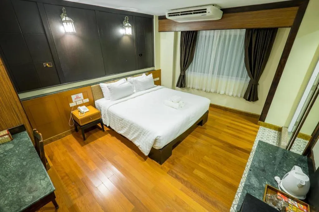 Bed in LANDMARK NAKHONPHANOM HOTEL