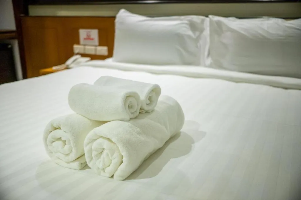 Bed in LANDMARK NAKHONPHANOM HOTEL