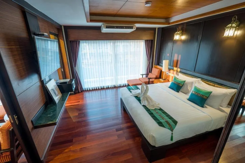 Bed in LANDMARK NAKHONPHANOM HOTEL